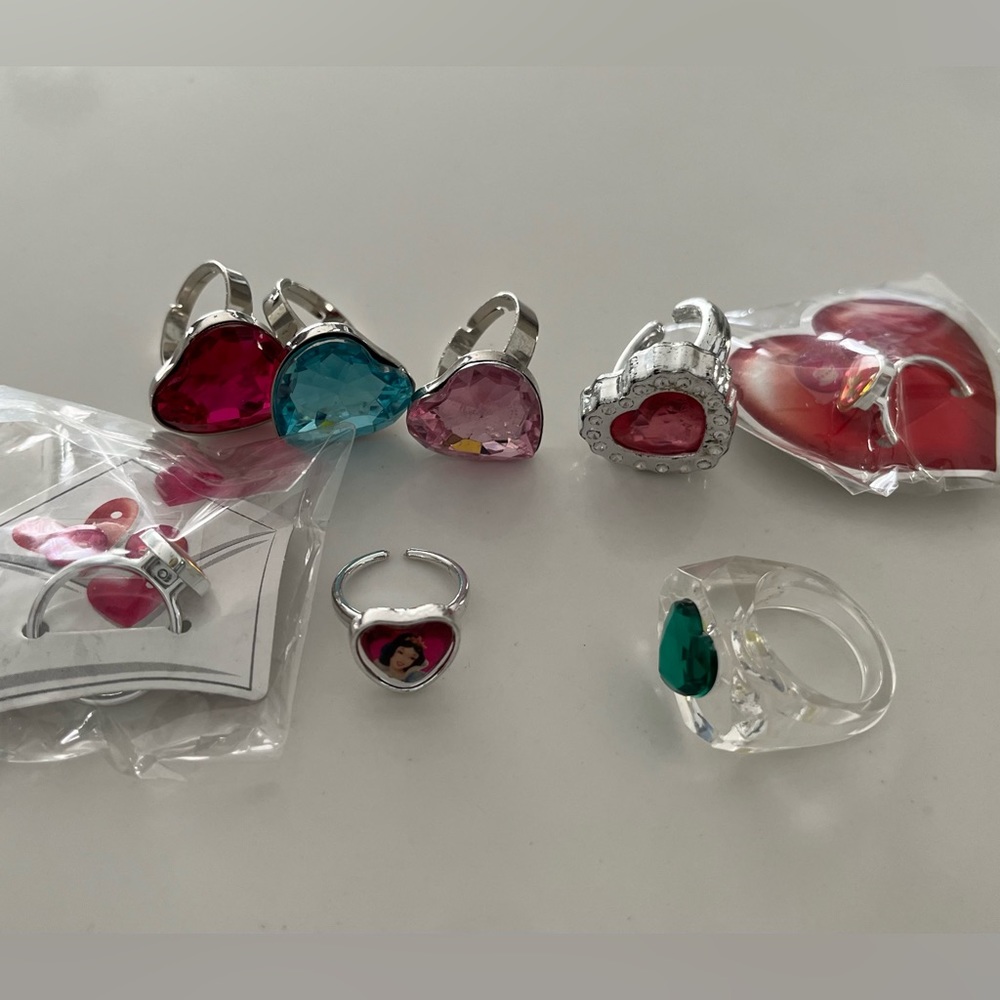 NWOT 8 plastic rings with hearts.  Perfect for kids dress up, party favors, fun!